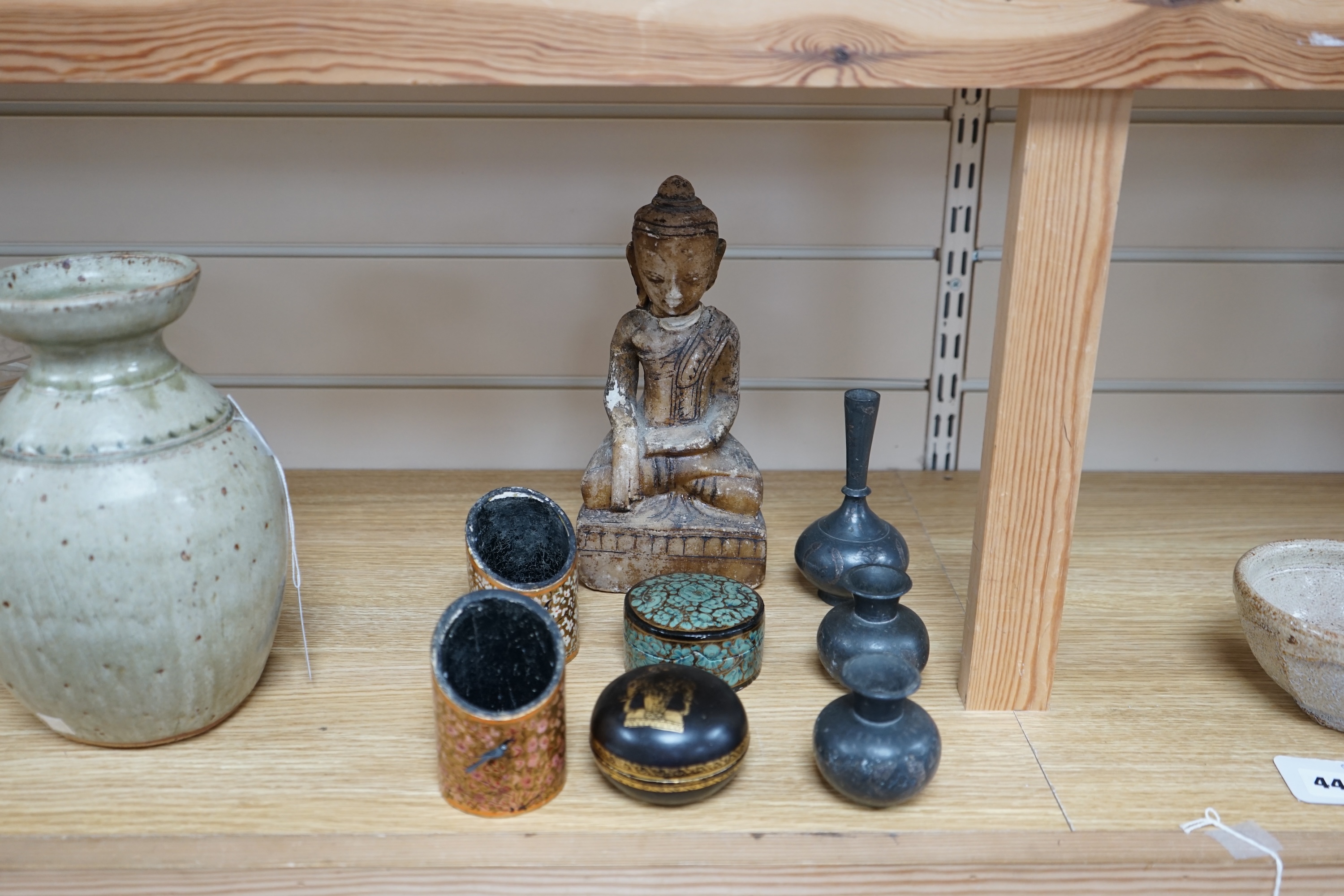 A collection of South East Asian and Indian collectables to include Bidri ware, alabaster Buddha and four papier mache pots, largest 26cm high. Condition - mostly fair